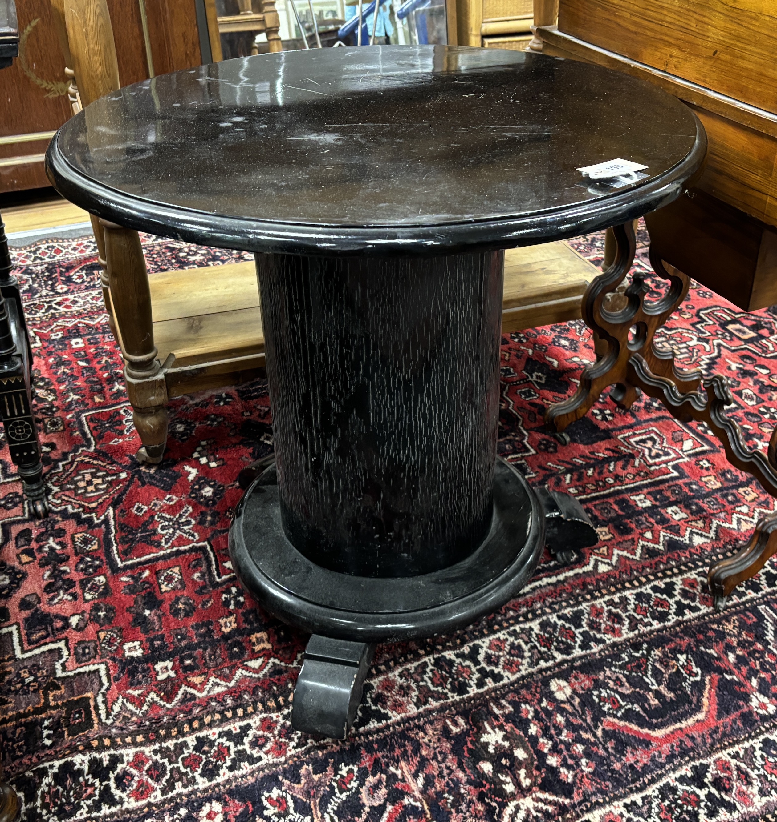 An Art Deco ebonised circular occasional table, diameter 71cm, height 72cm. Condition - poor